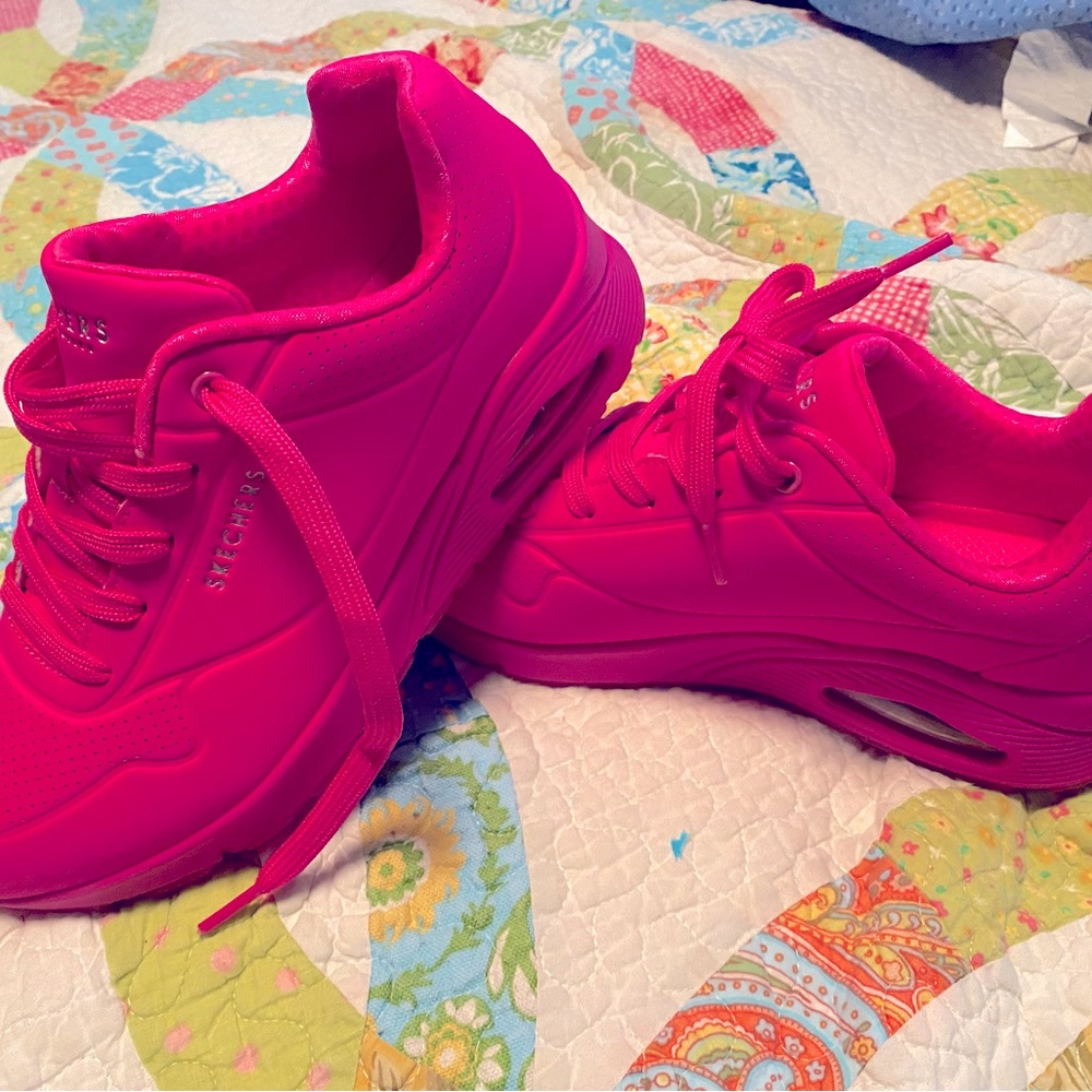 A pair of Hot Pink skechers.   Never been worn.  Size 8.5